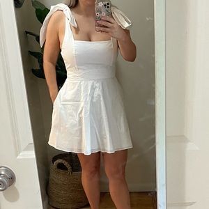 Showmeyourmumu white mini dress with bow sleeves.